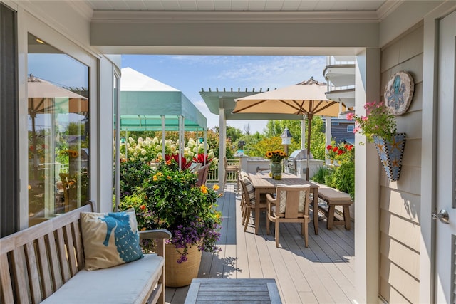 wooden terrace featuring outdoor dining area