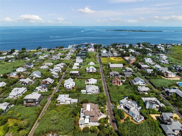 birds eye view of property featuring a water view and a residential view