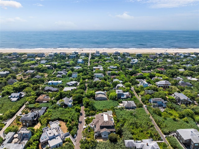 aerial view with a water view and a view of the beach