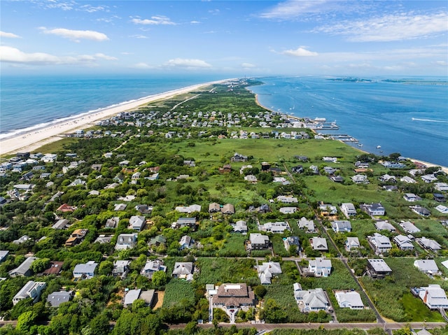 bird's eye view with a water view and a view of the beach