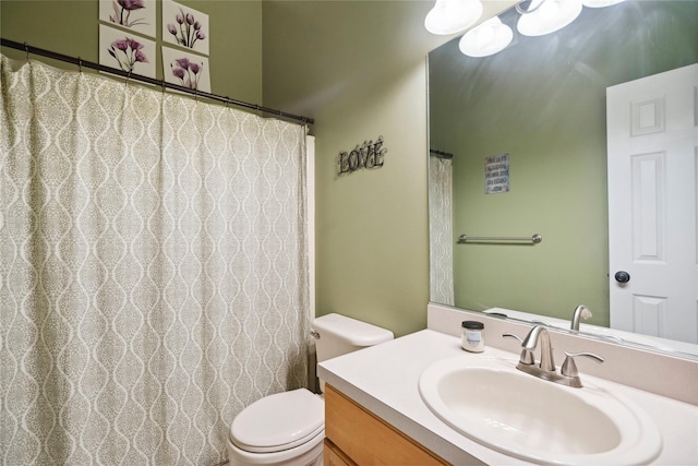 bathroom with toilet and vanity