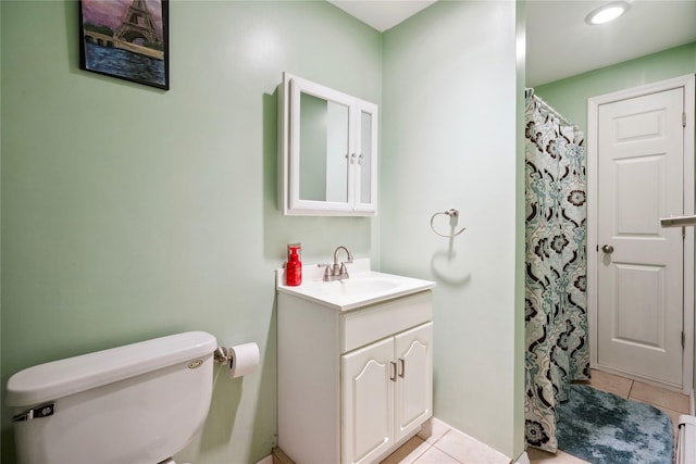 bathroom featuring vanity, tile patterned floors, toilet, and a shower with shower curtain