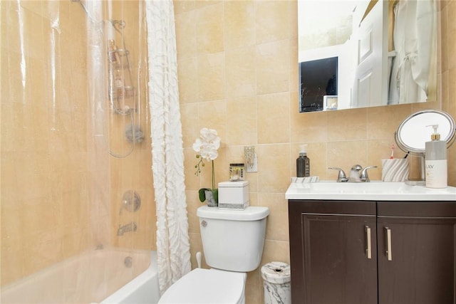 full bath featuring vanity, shower / bath combination with curtain, toilet, and tile walls