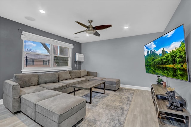 living area featuring baseboards, ceiling fan, recessed lighting, and light wood-style floors