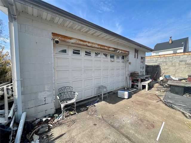 garage with fence