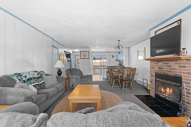 carpeted living room featuring baseboard heating and a fireplace