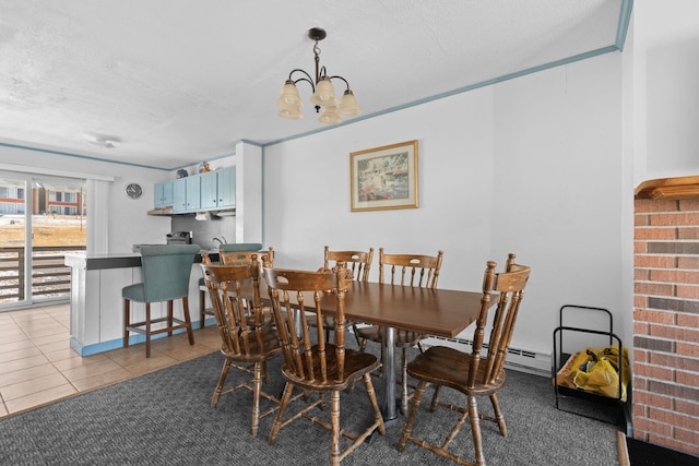 dining area with a baseboard heating unit, a chandelier, light tile patterned flooring, and a textured ceiling