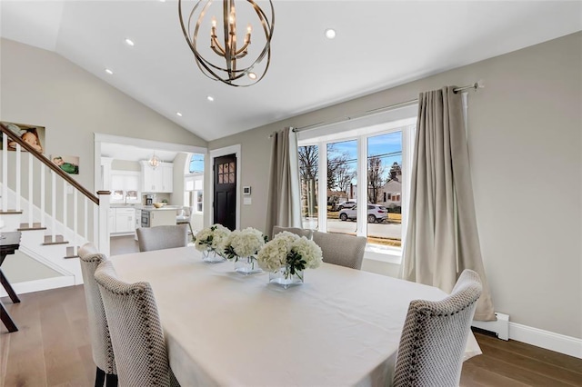 dining room with lofted ceiling, a chandelier, baseboards, stairs, and dark wood finished floors