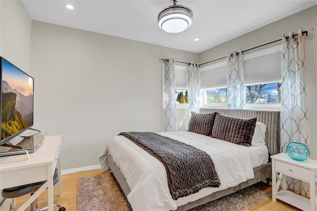 bedroom featuring recessed lighting, baseboards, and wood finished floors