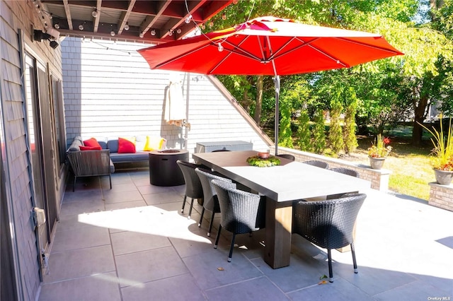 view of patio featuring outdoor dining area