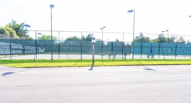 view of sport court with fence