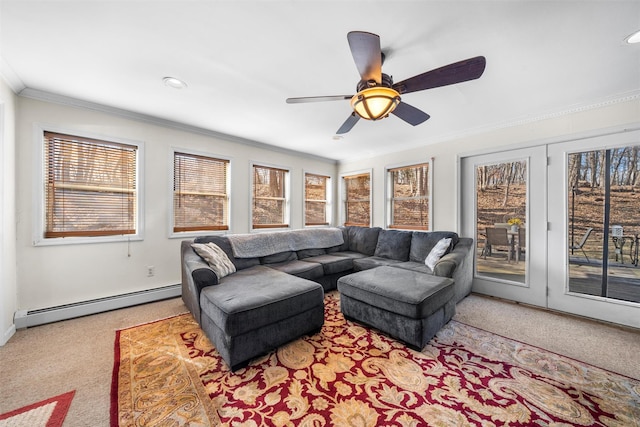 carpeted living room featuring a baseboard radiator, ceiling fan, and crown molding