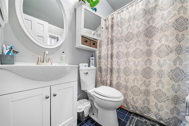 bathroom with tile patterned floors, toilet, vanity, and a shower with curtain