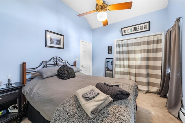 bedroom with baseboard heating, ceiling fan, carpet, and vaulted ceiling