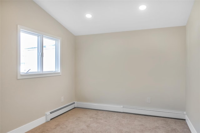 empty room featuring lofted ceiling, recessed lighting, baseboards, and light colored carpet