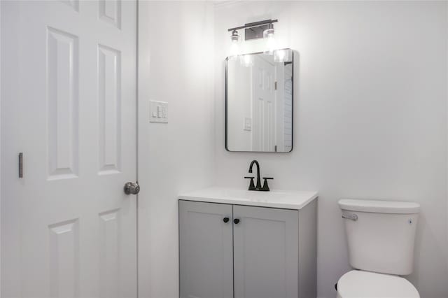 half bath with vanity and toilet