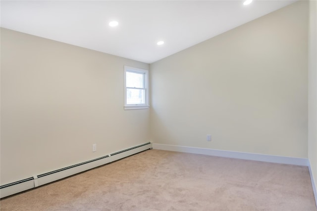 empty room featuring light carpet, baseboards, baseboard heating, and recessed lighting