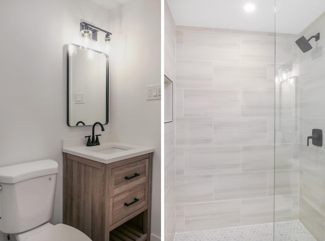 full bath featuring a tile shower, vanity, and toilet