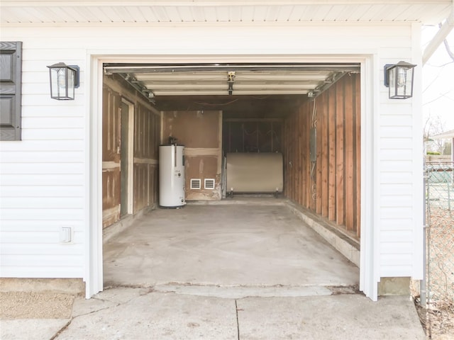 garage featuring gas water heater and heating fuel