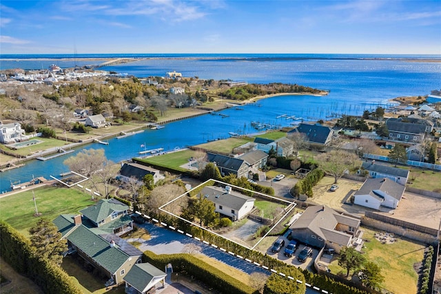 bird's eye view featuring a residential view and a water view