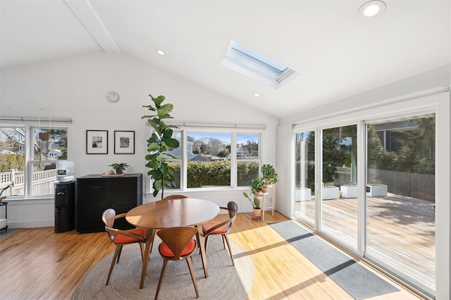 dining area featuring a wealth of natural light, recessed lighting, a skylight, and wood finished floors