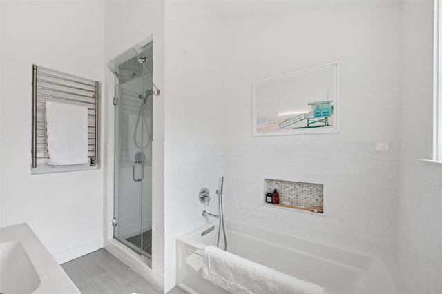 full bathroom with a shower stall and a garden tub