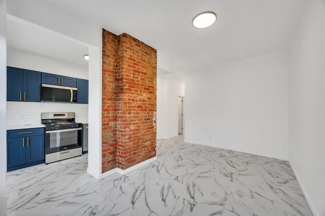 kitchen with blue cabinets, stainless steel appliances, baseboards, marble finish floor, and tasteful backsplash