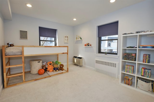 carpeted bedroom featuring radiator, baseboards, and recessed lighting