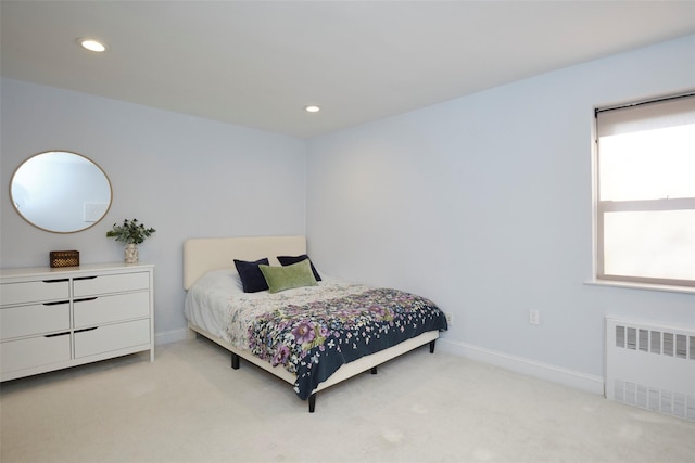 bedroom featuring recessed lighting, radiator, light colored carpet, and baseboards