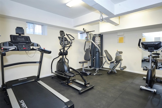 workout area featuring baseboards