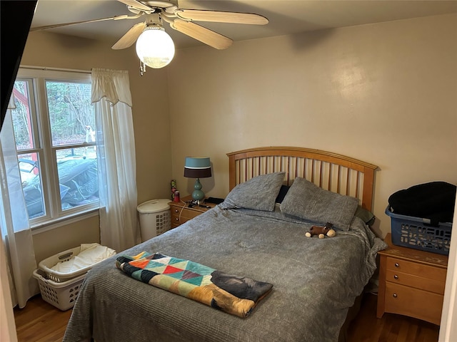 bedroom with a ceiling fan and wood finished floors