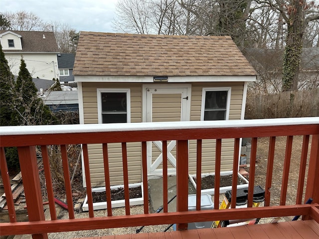 wooden deck featuring an outdoor structure