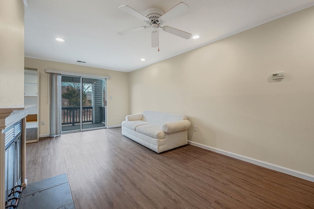 unfurnished room featuring recessed lighting, wood finished floors, visible vents, and baseboards