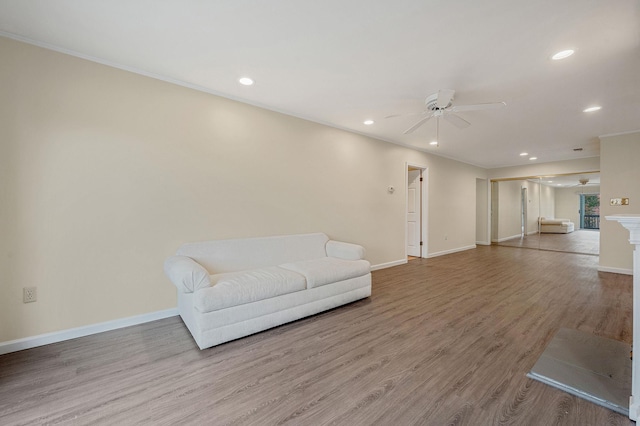 sitting room featuring recessed lighting, baseboards, and wood finished floors