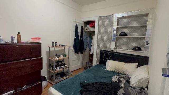 bedroom with wood finished floors