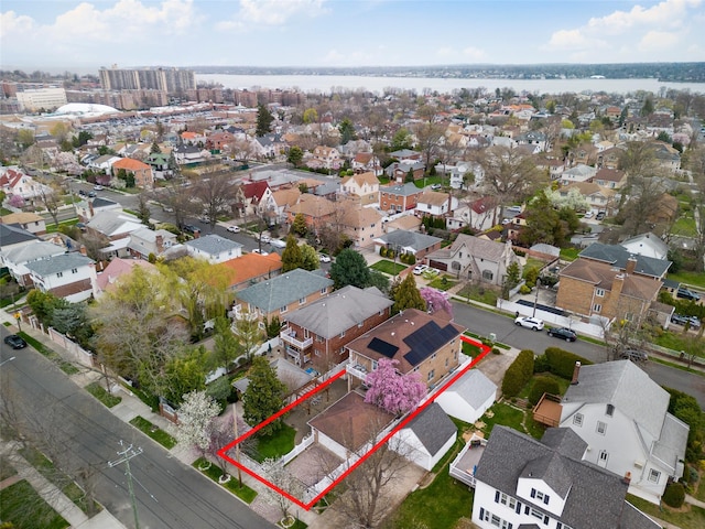 birds eye view of property with a residential view