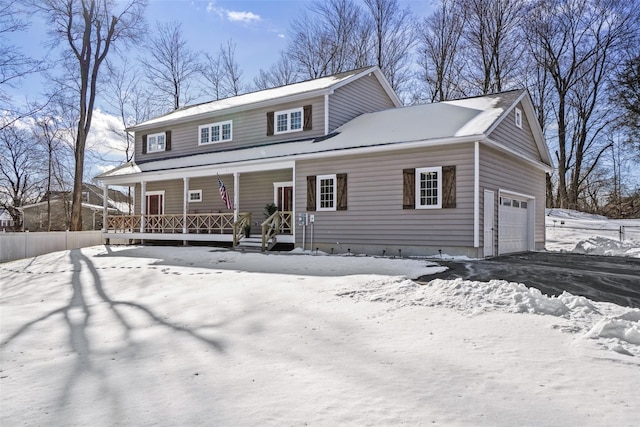 view of front of house featuring a garage and covered porch