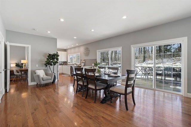 dining room with recessed lighting and hardwood / wood-style floors