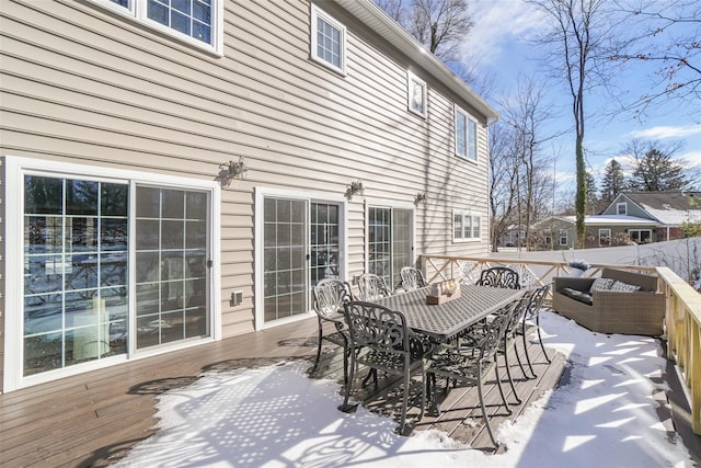 wooden deck featuring outdoor dining area and fence