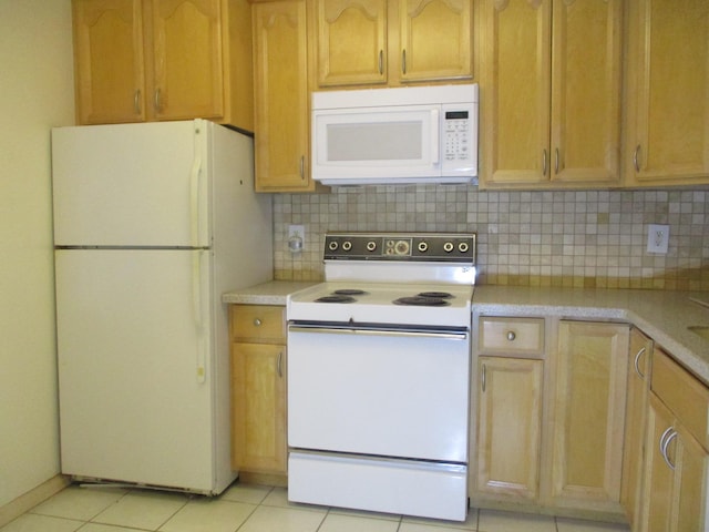 kitchen featuring light countertops, white appliances, light tile patterned flooring, and decorative backsplash