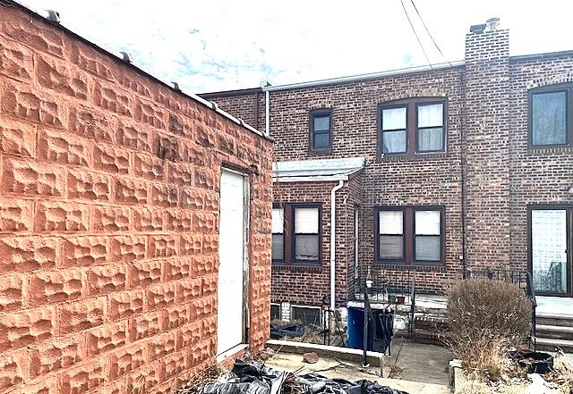 view of home's exterior with brick siding