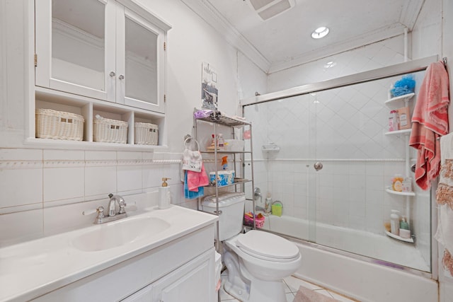 bathroom with toilet, bath / shower combo with glass door, vanity, ornamental molding, and tasteful backsplash