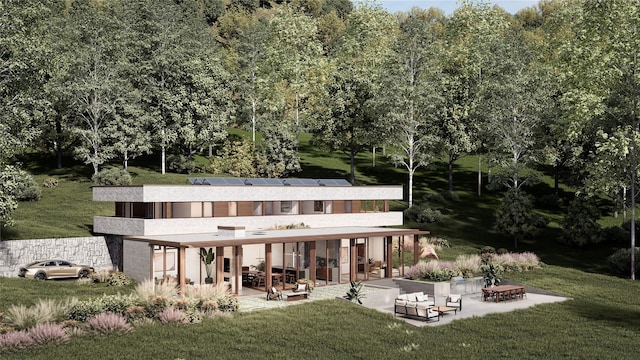 back of property with solar panels, a patio, a yard, and a fire pit