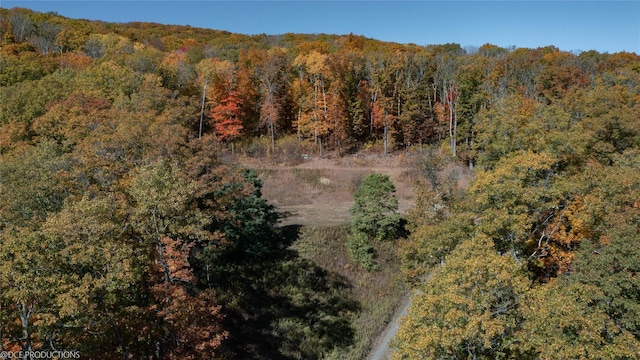 aerial view featuring a view of trees