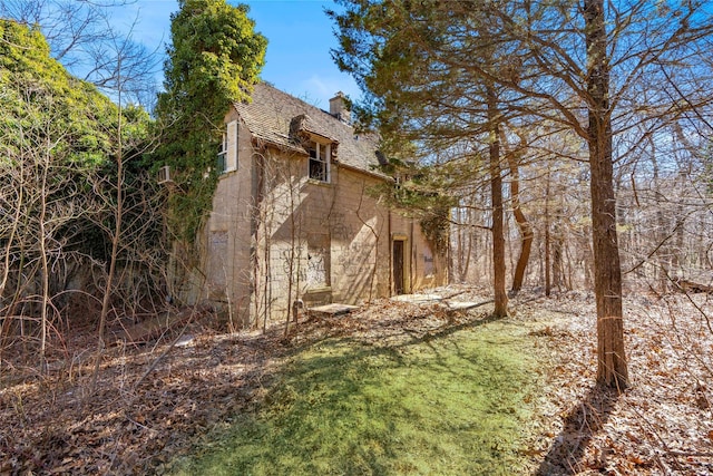 2340 Cedar Swamp Rd, Brookville, NY 11545 - view of side of property with a chimney