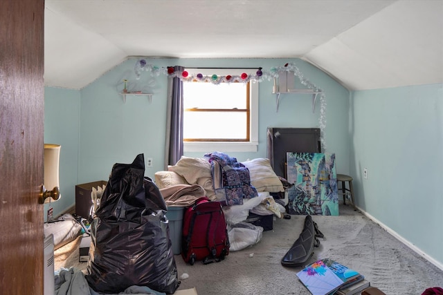 additional living space with carpet flooring, vaulted ceiling, and baseboards