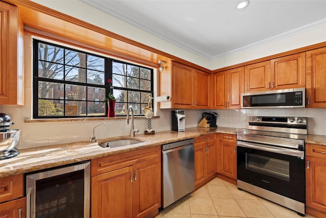 kitchen with wine cooler, backsplash, appliances with stainless steel finishes, ornamental molding, and a sink