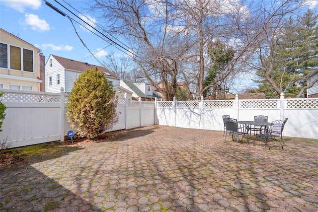 view of yard with a fenced backyard and a patio