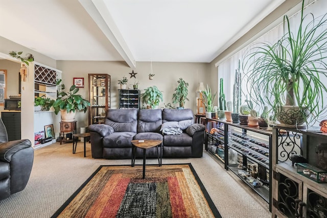 living room with carpet and beam ceiling