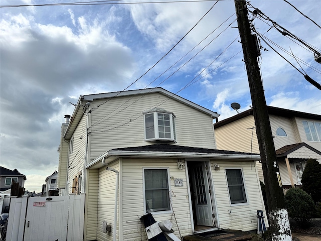 view of front of house with fence